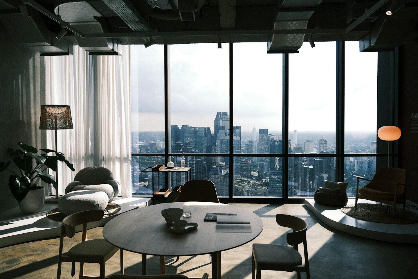 Modern office interior overlooking a dense city skyline.